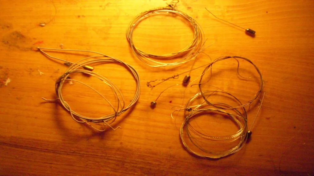 Broken guitar strings during restringing process