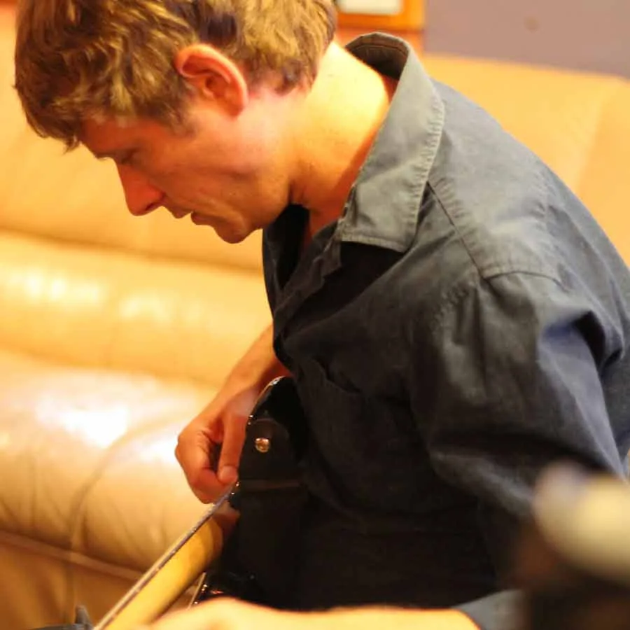 Simon Morel practicing guitar