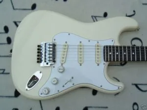 Classic white Fender Stratocaster with a Kahler tremolo bridge setup